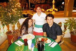 Guests dining on the restaurant terrace